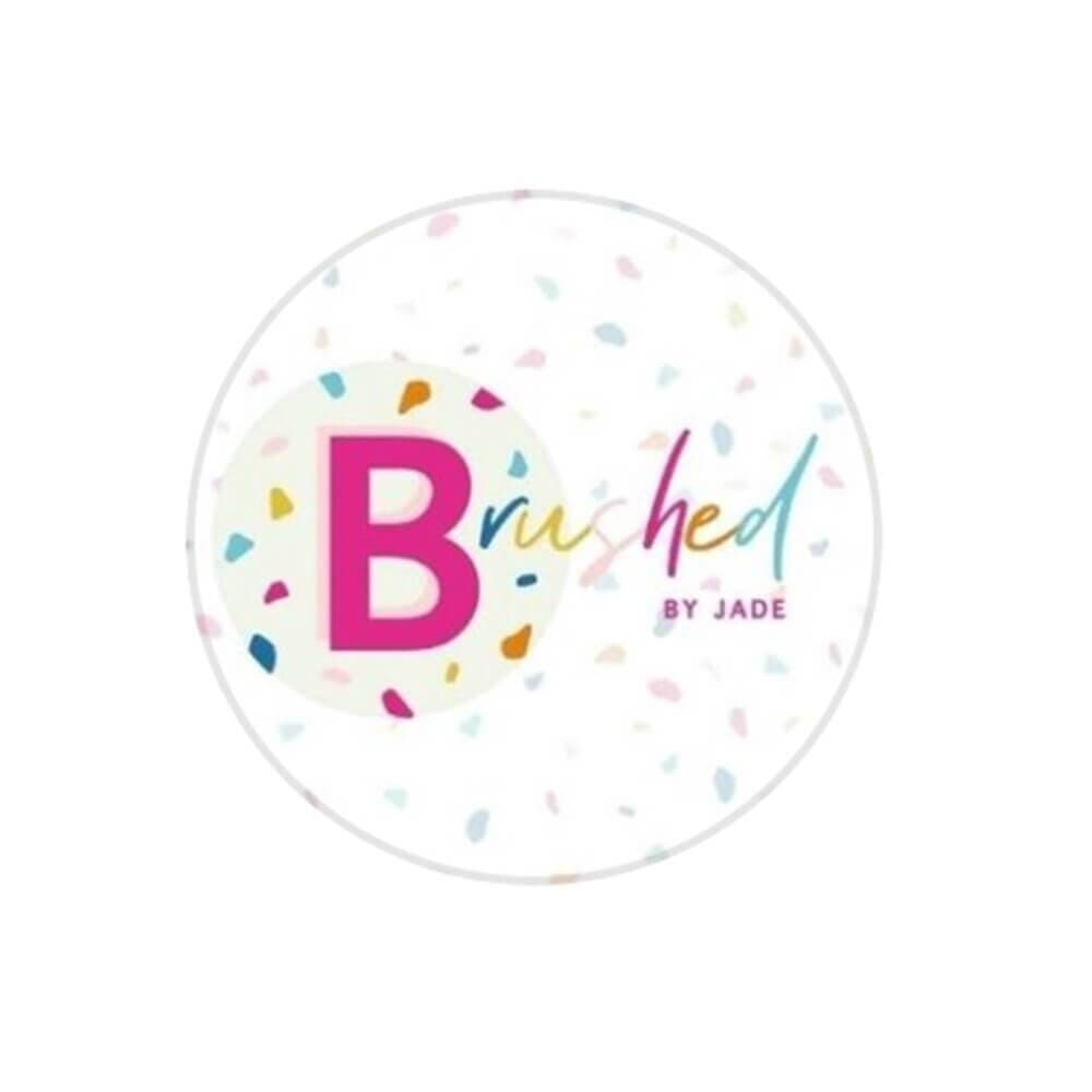 Logo with a large pink "B" and colorful confetti. Text reads "Brushed by Jade" in a mix of blue, pink, and green. - Home Instead