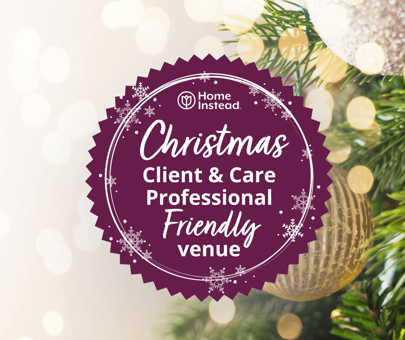 Circular sign reading "Christmas Client & Care Professional Friendly venue" next to a decorated Christmas tree. - Home Instead