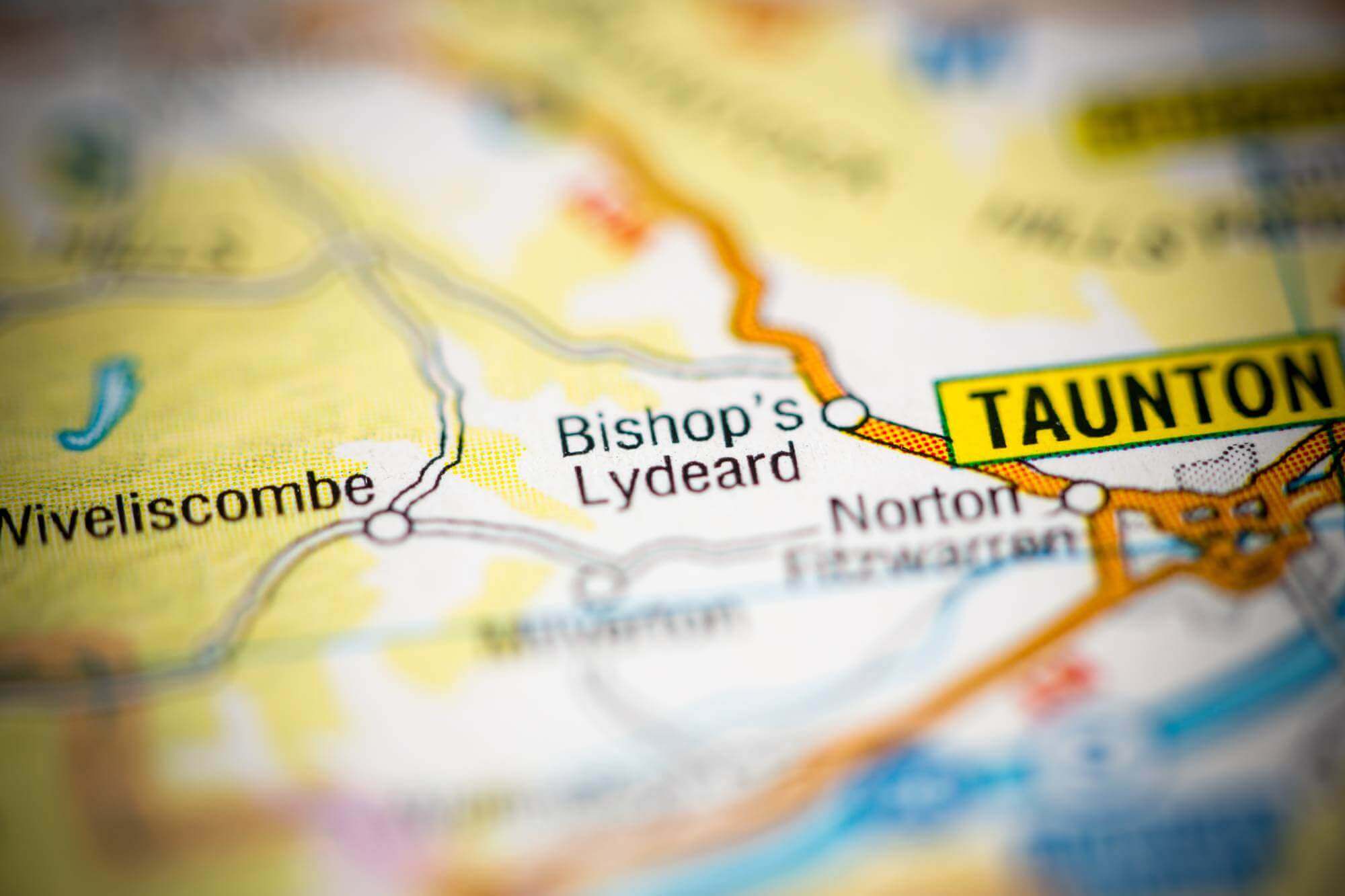 A map showing Bishop's Lydeard, Taunton, Wiveliscombe, and nearby areas with roads and geographical details. - Home Instead