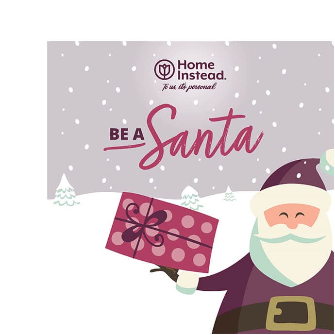 Illustration of Santa holding a gift with "Home Instead. To us, it’s personal. Be a Santa" text in snowy background. - Home Instead