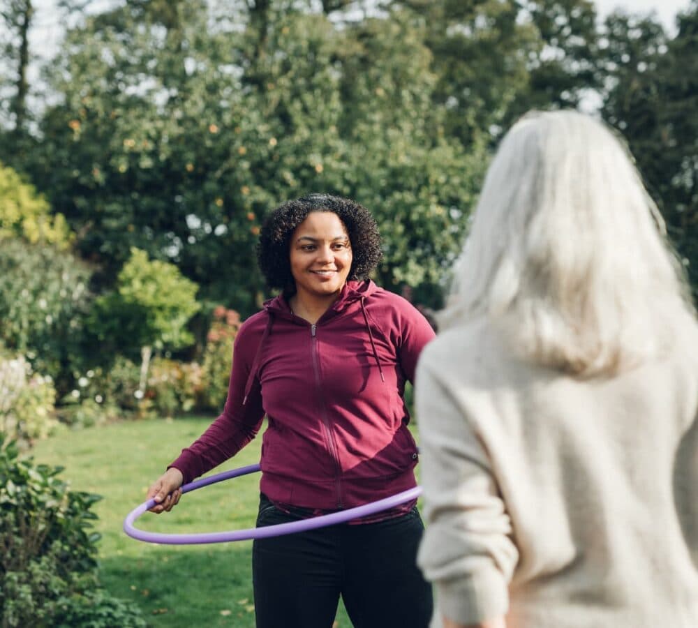 Home Instead Southampton Care Professional enjoying activity in the garden with client