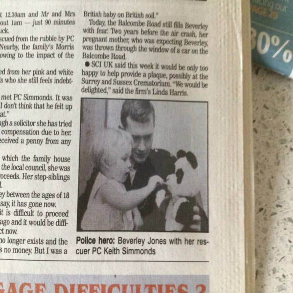 Newspaper clipping shows a police officer and a child with a stuffed animal, with a headline about a rescue. - Home Instead