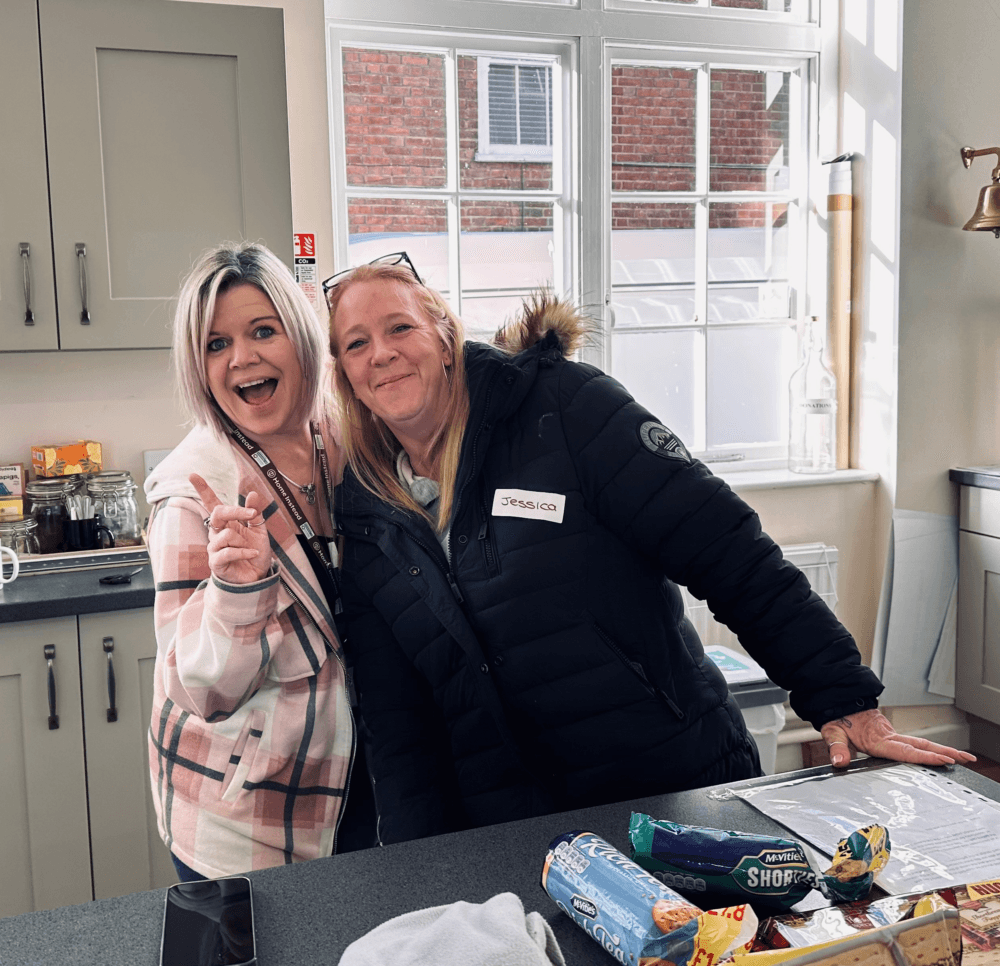 Staff smiling at Home Instead's Dementia Friendly Community Café in Baldock