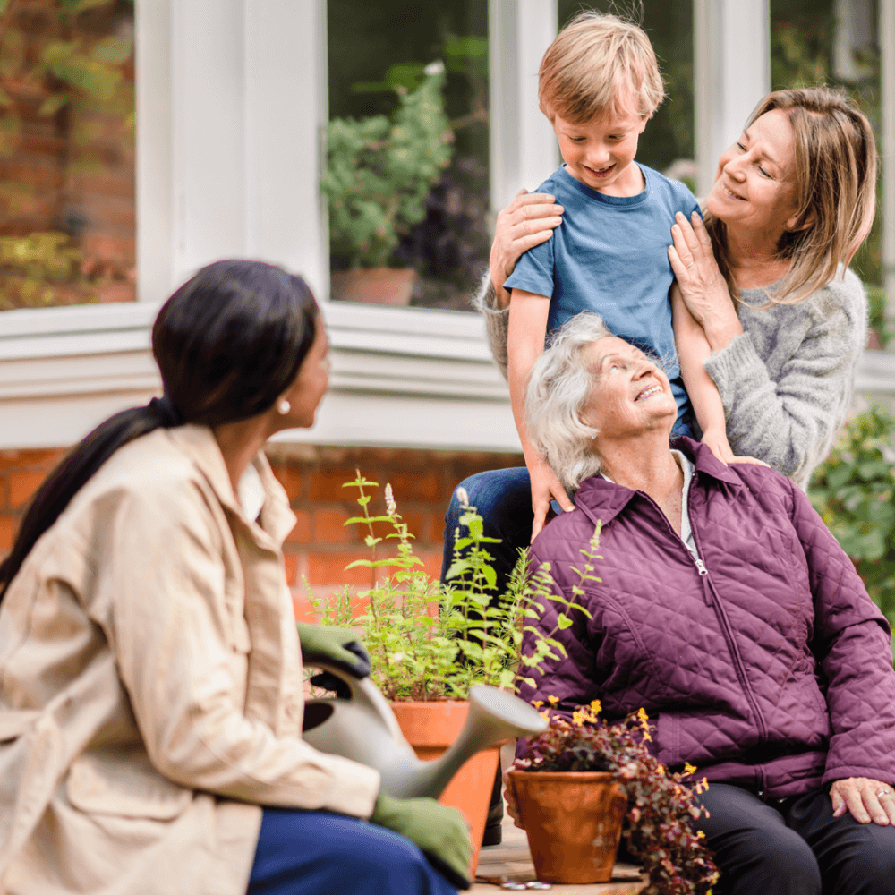 care professional sitting with client and her family