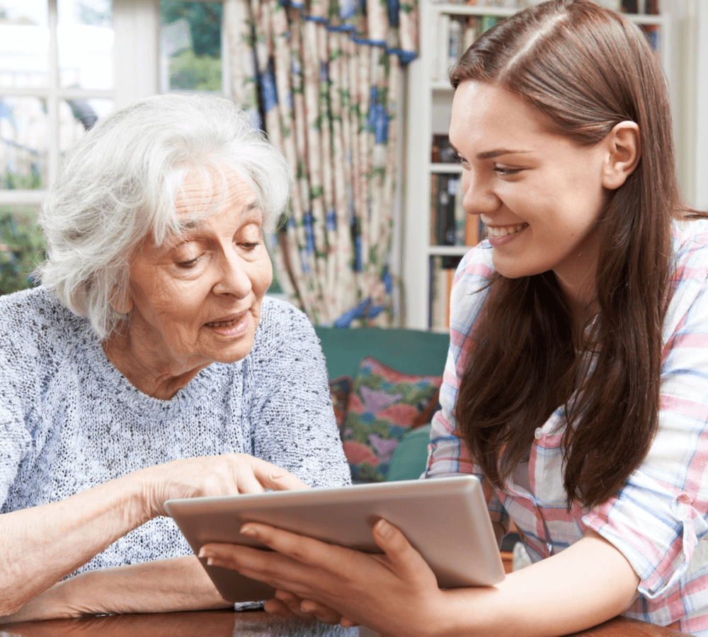 Home Instead Southampton Care Professional using tablet