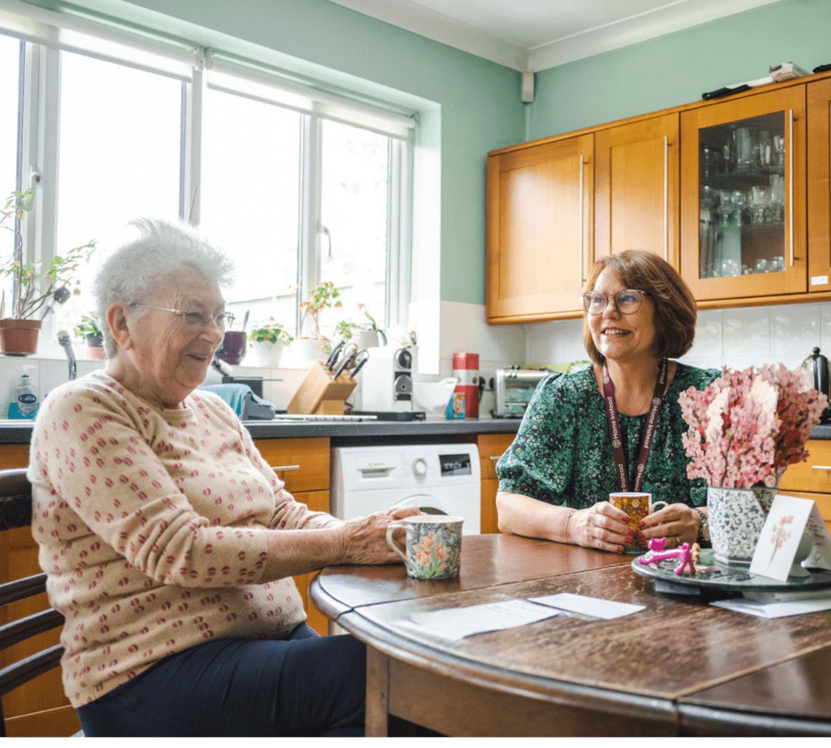 Home Instead Poole Care Professional with live-in care client