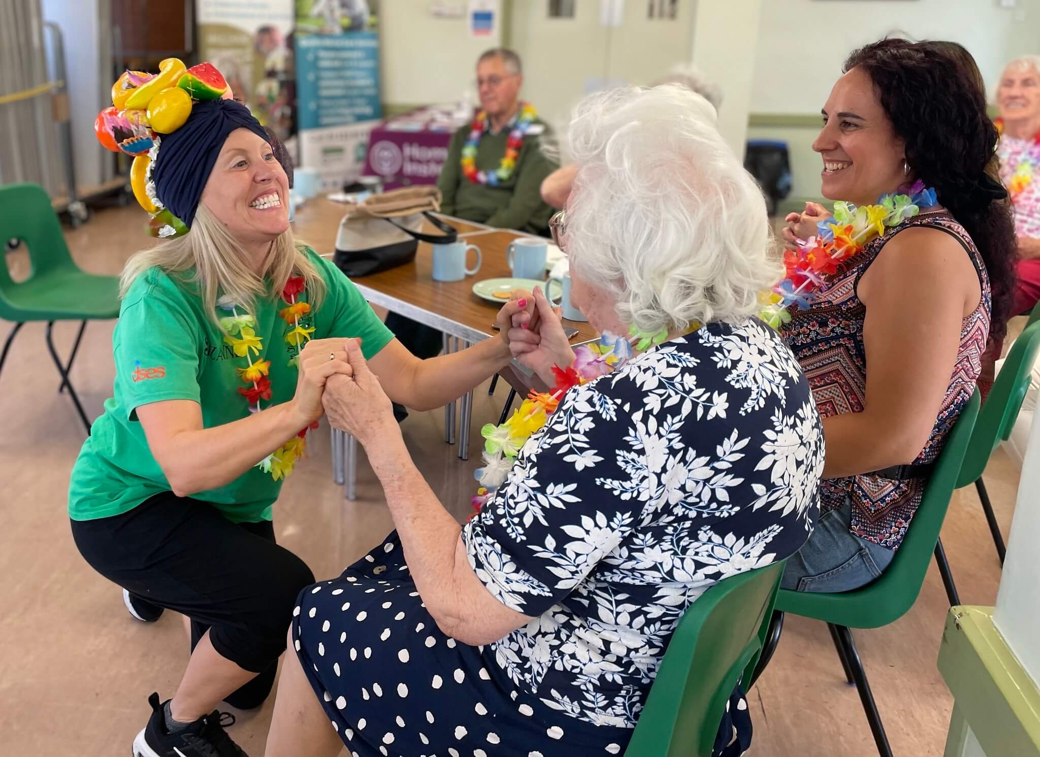 Elderly woman enjoying entertainment at Home Instead dementia-friendly event