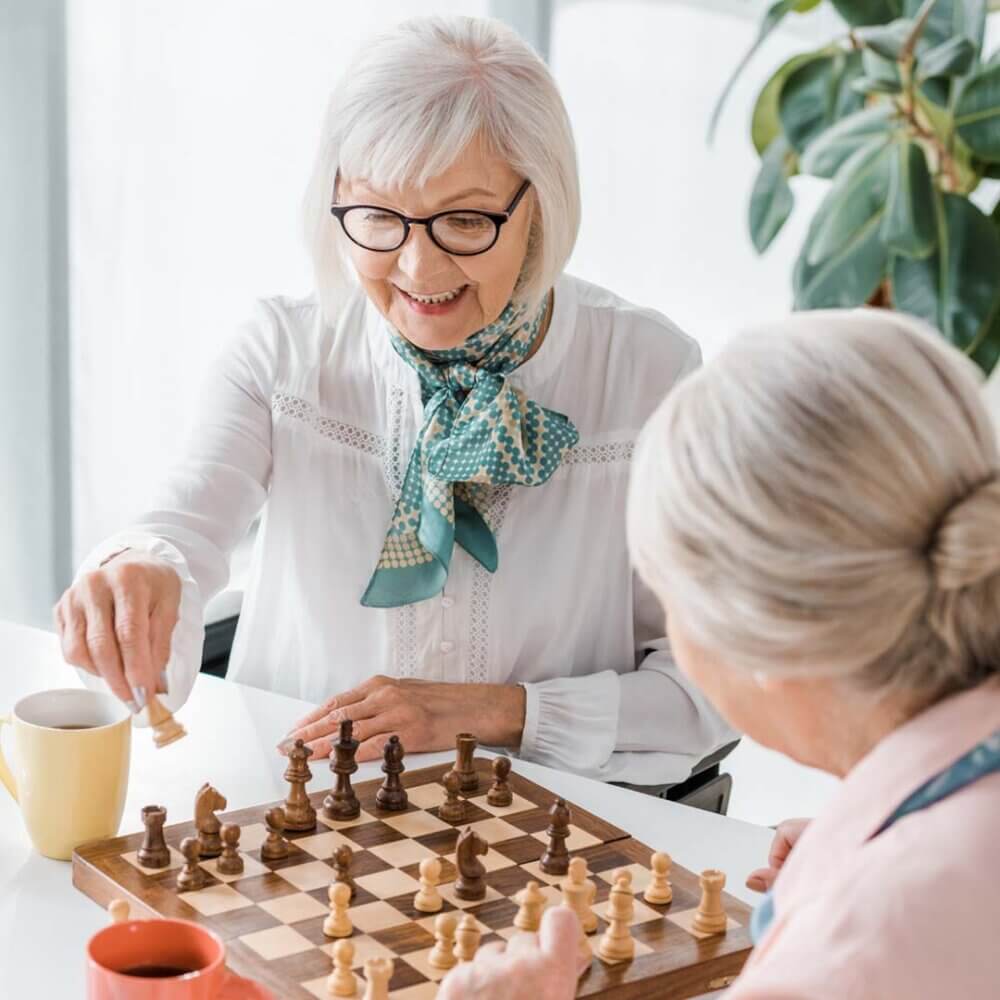 two older ladies playing chess together