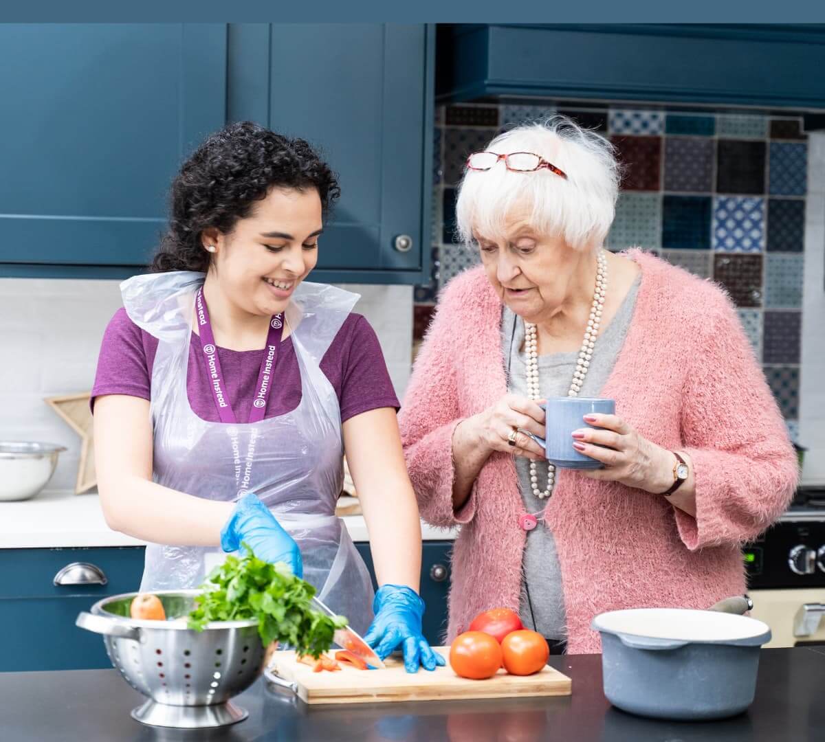 Home Instead Southampton Care Professional meal preparing for client