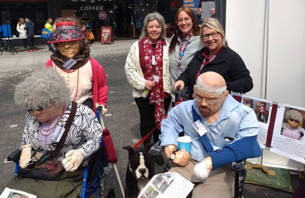 Home Instead team with dummies