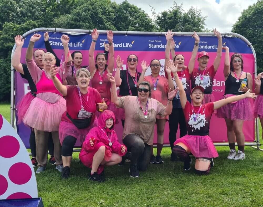 The Home Instead team at Race For Life Pretty Muddy celebrating after the event