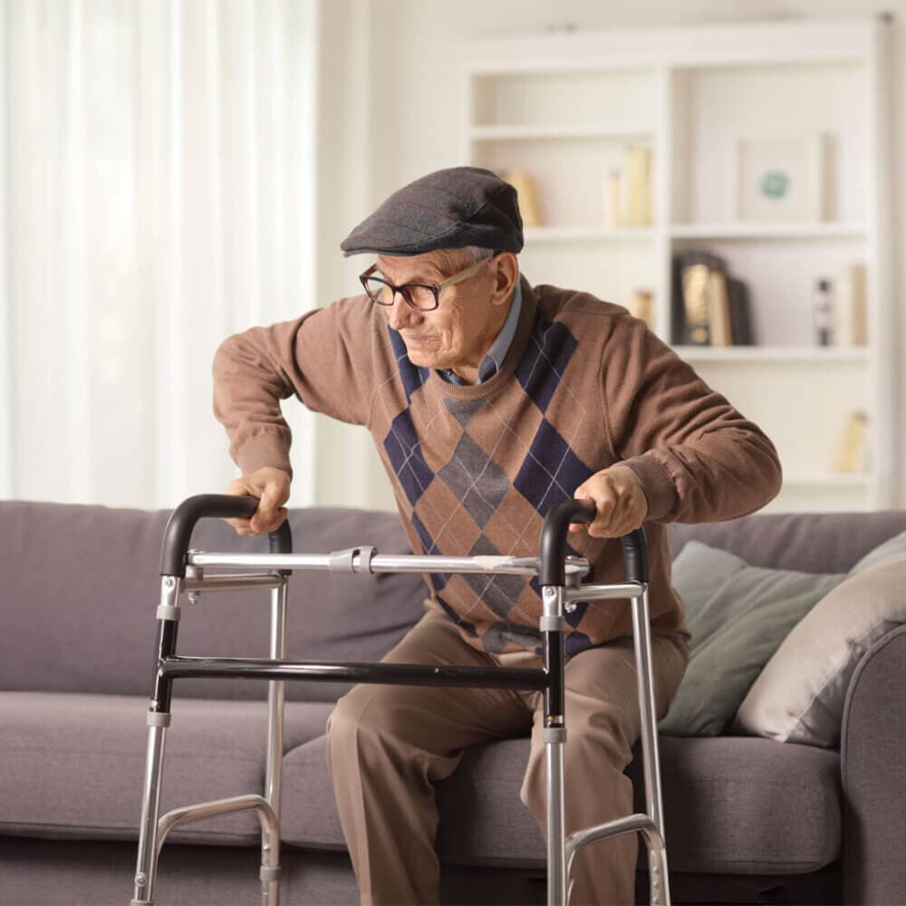 senior man standing with walking aid