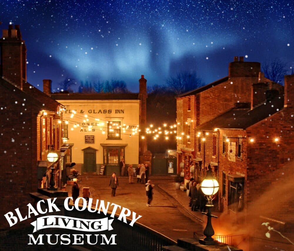 A nighttime street scene at the Black Country Living Museum with string lights and a starry sky. - Home Instead