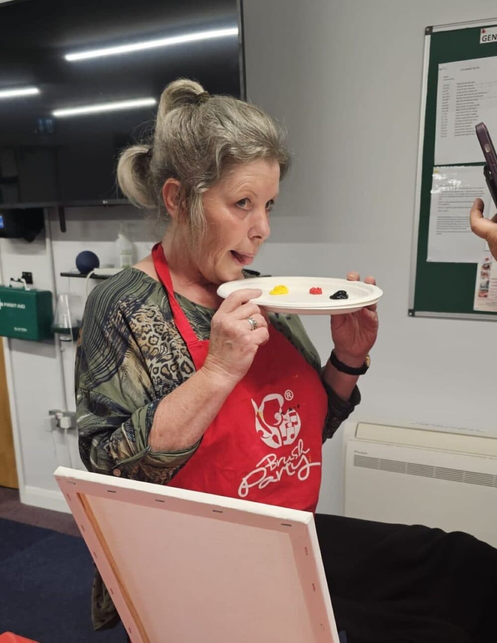 Janet collecting her paint