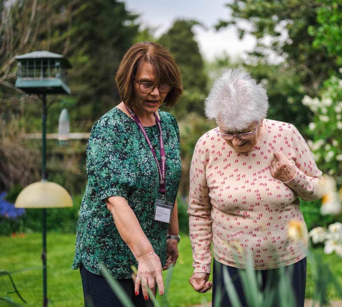 Home Instead Poole Care Professional enjoying gardening with client