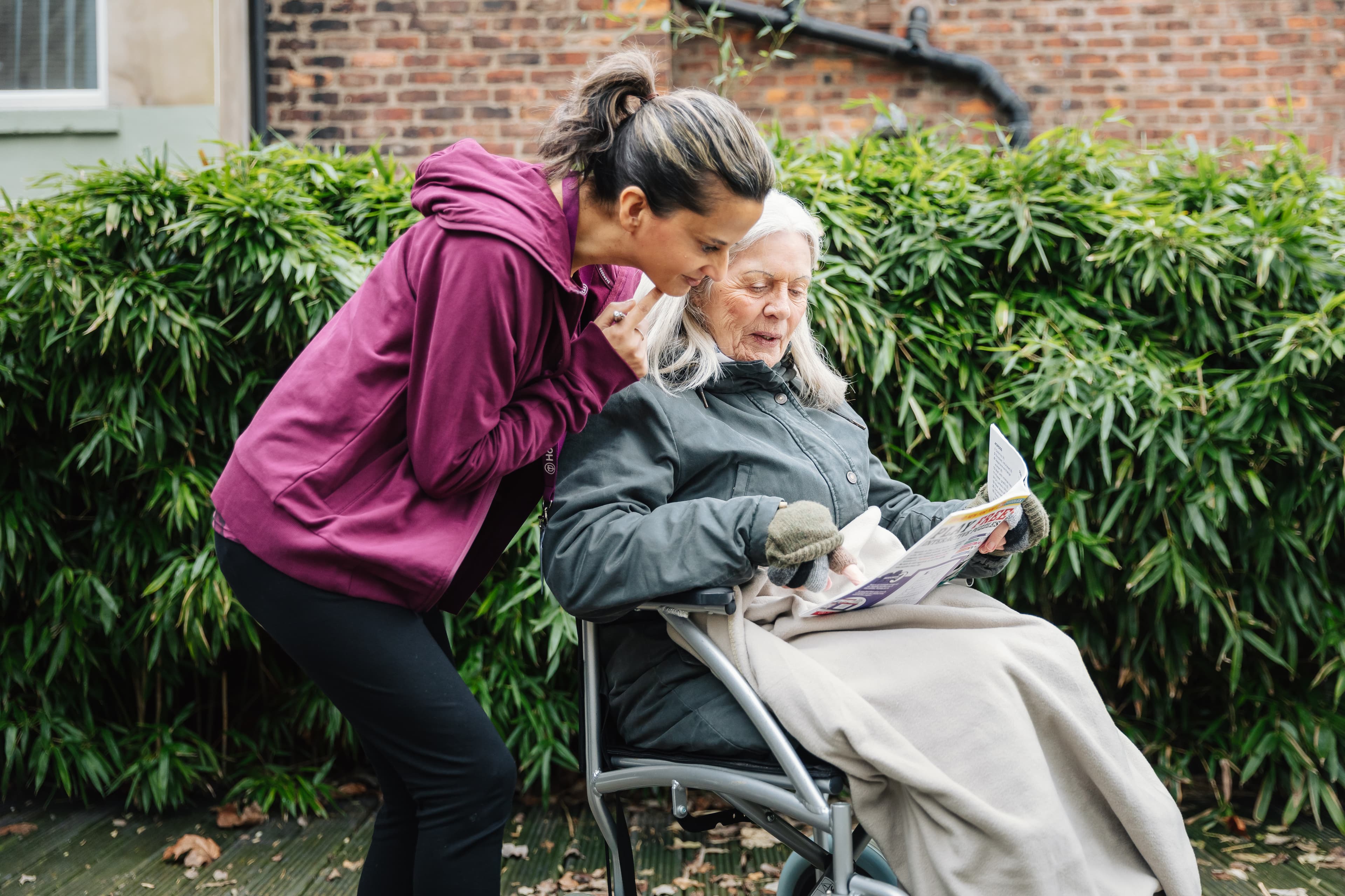 Care Professional helping client with puzzle - Home Instead
