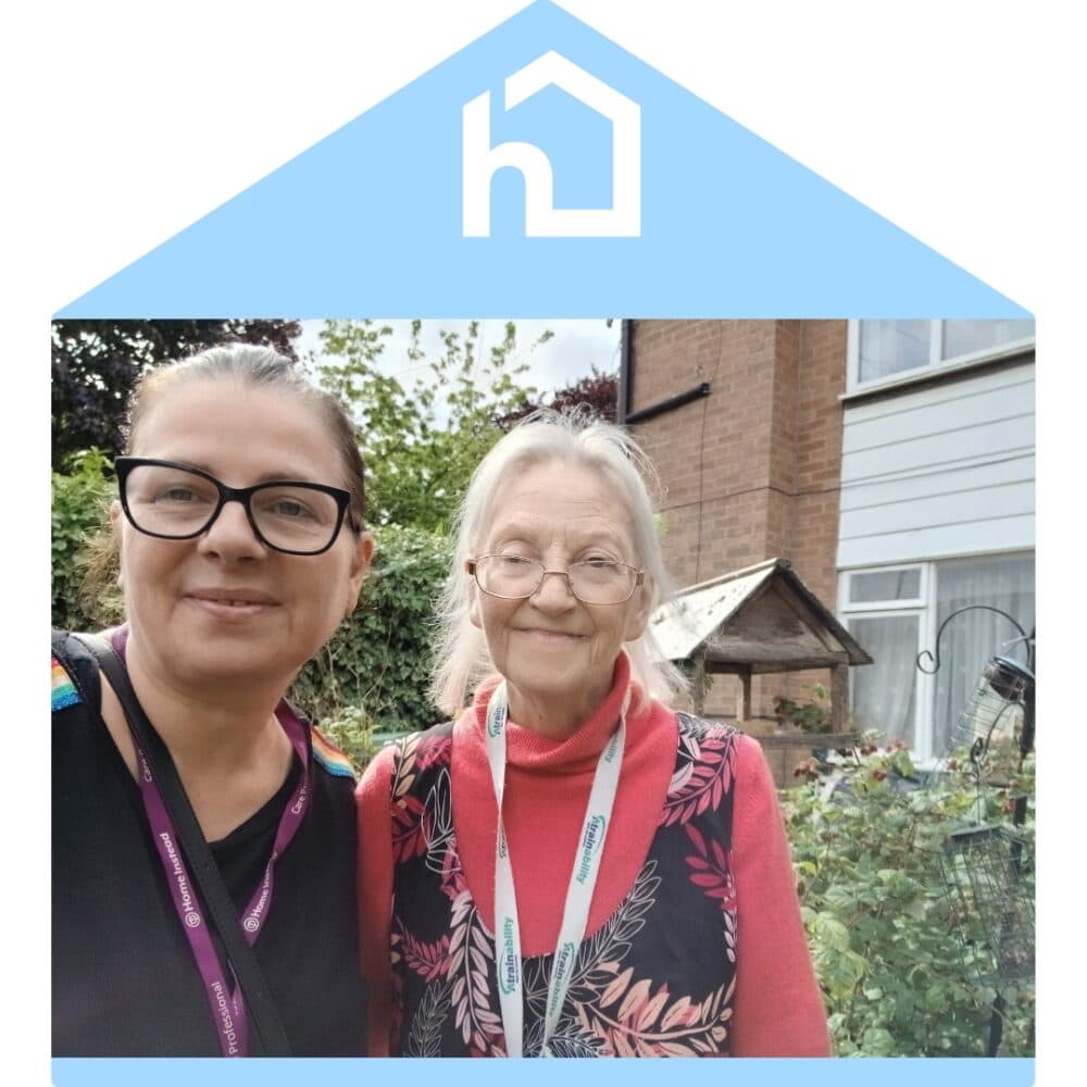 Care Pro and Client out in the garden Quality home Care at Home Home Instead Altrincham Sale and Wythenshawe