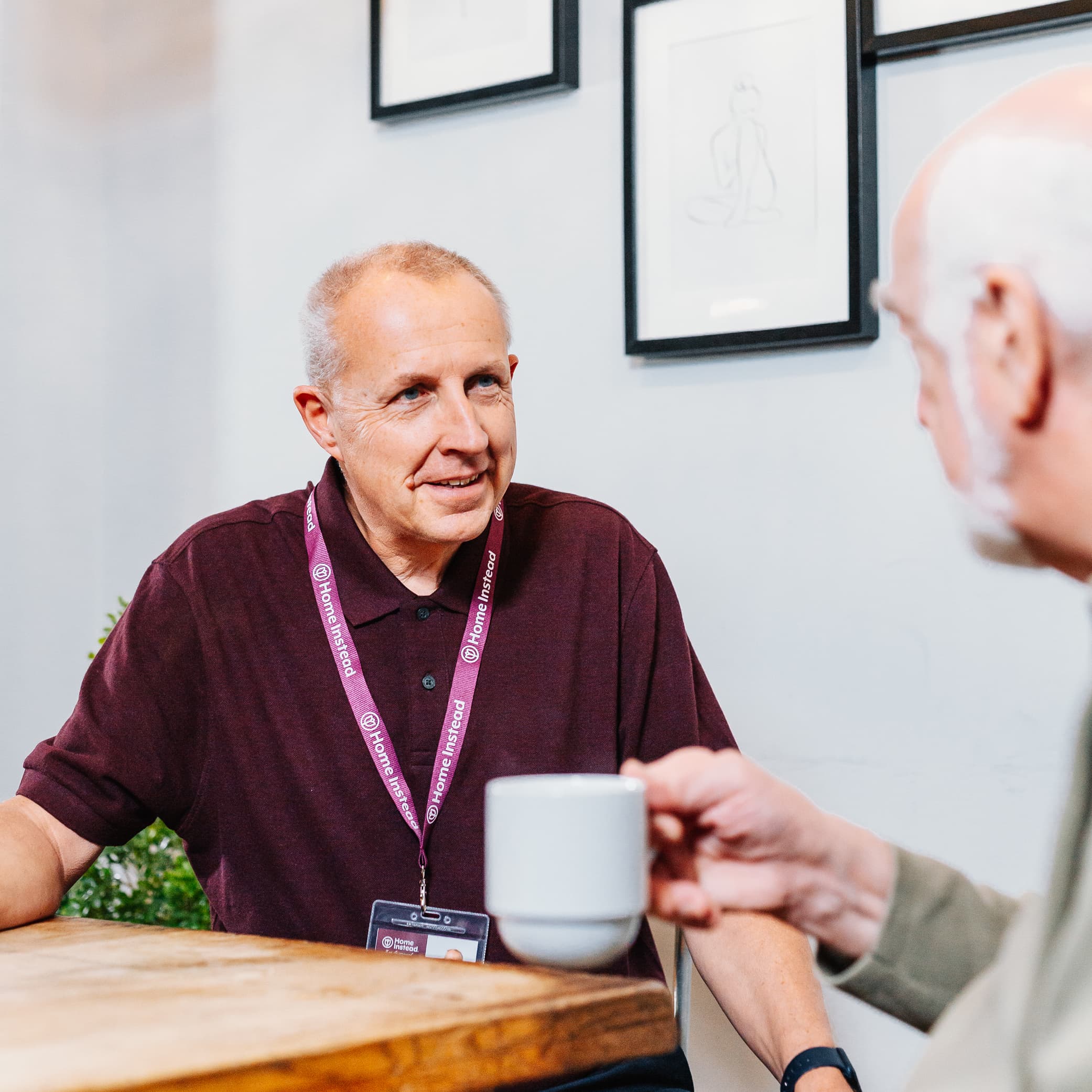 Caregiver providing compassionate home care services to an elderly person in Leeds, offering personalized support including meal preparation, companionship, and dementia care.
