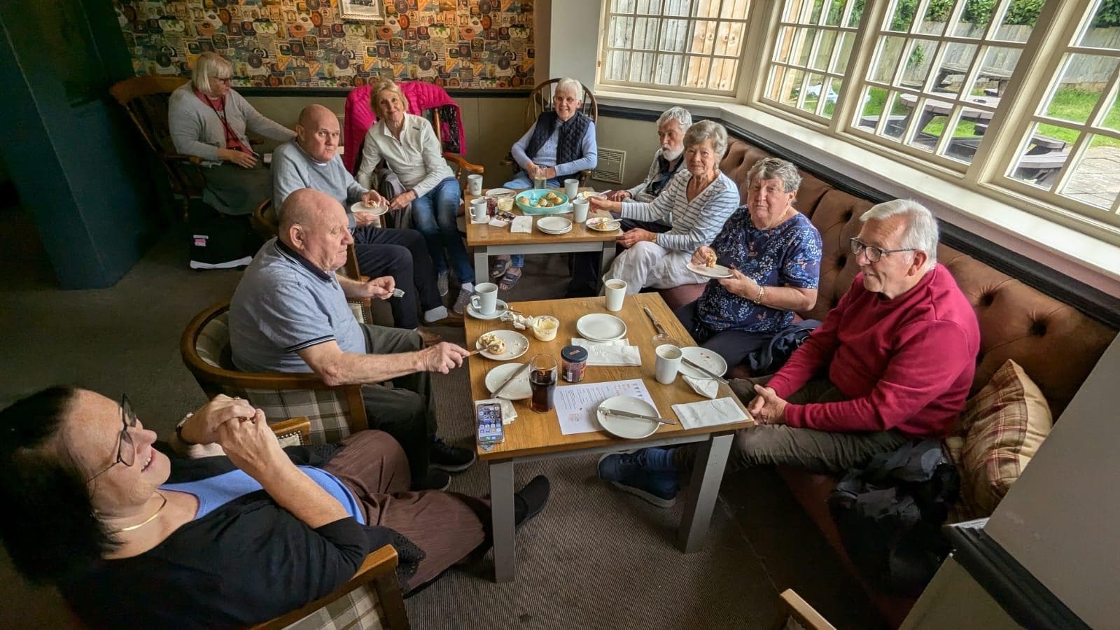 Guests at our Memory Cafe socialising together over a cream tea