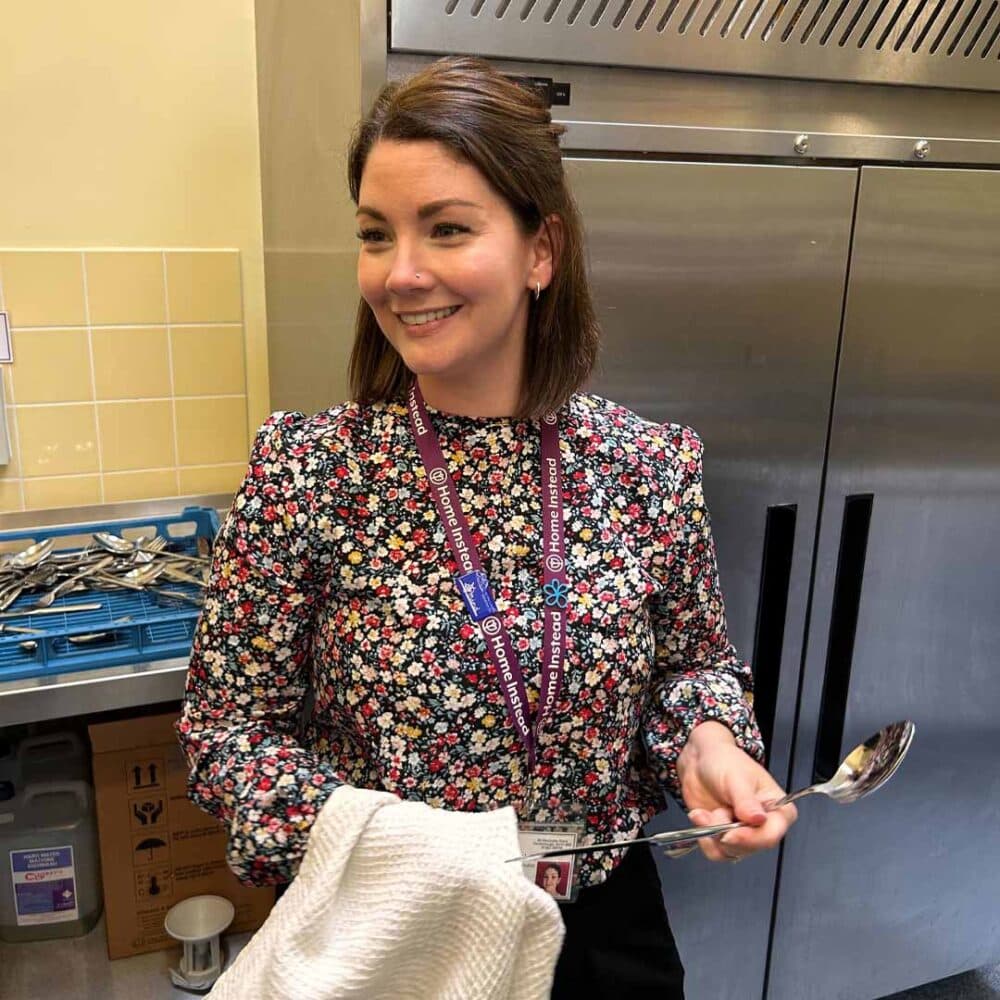 Home Instead's Lauren Mitchell supporting in the kitchen at the Farnham Assist community event