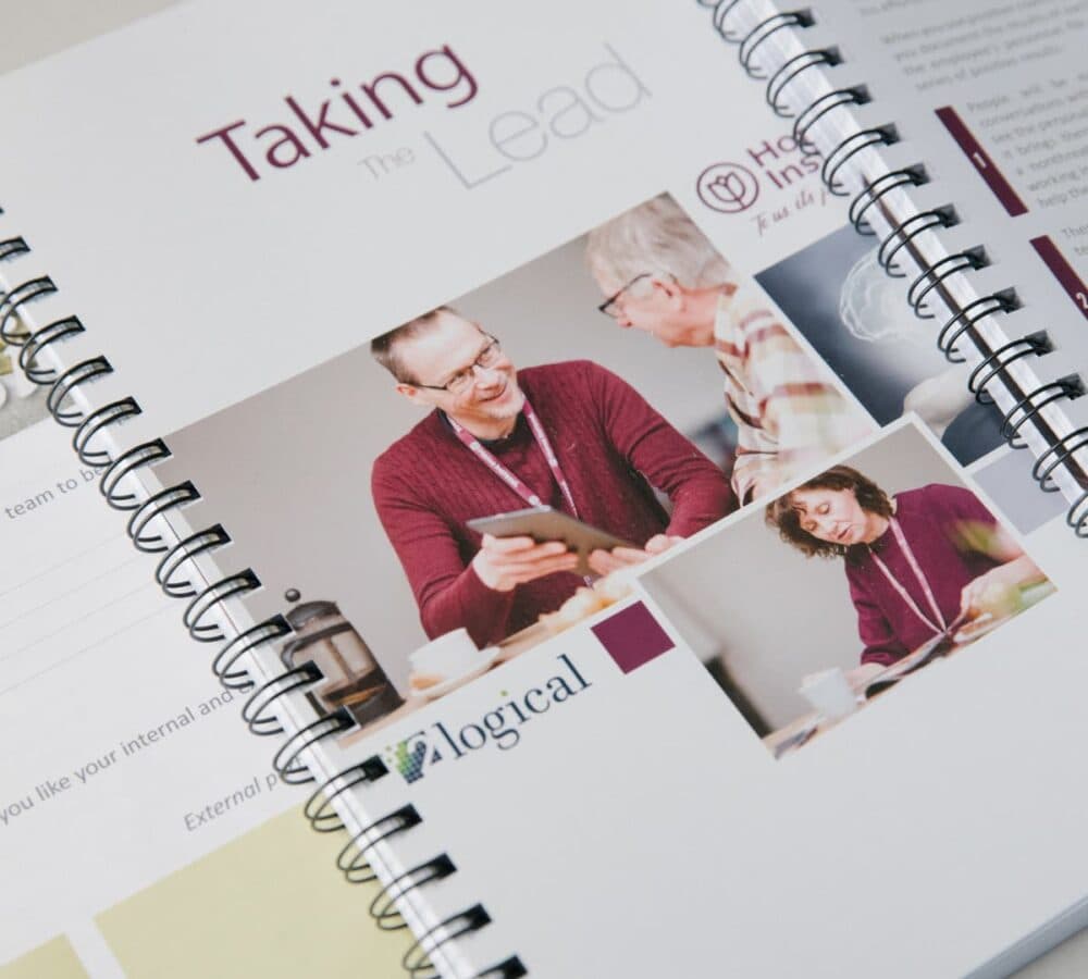 Training manual in spiral bound with photo cover of a carer and a senior