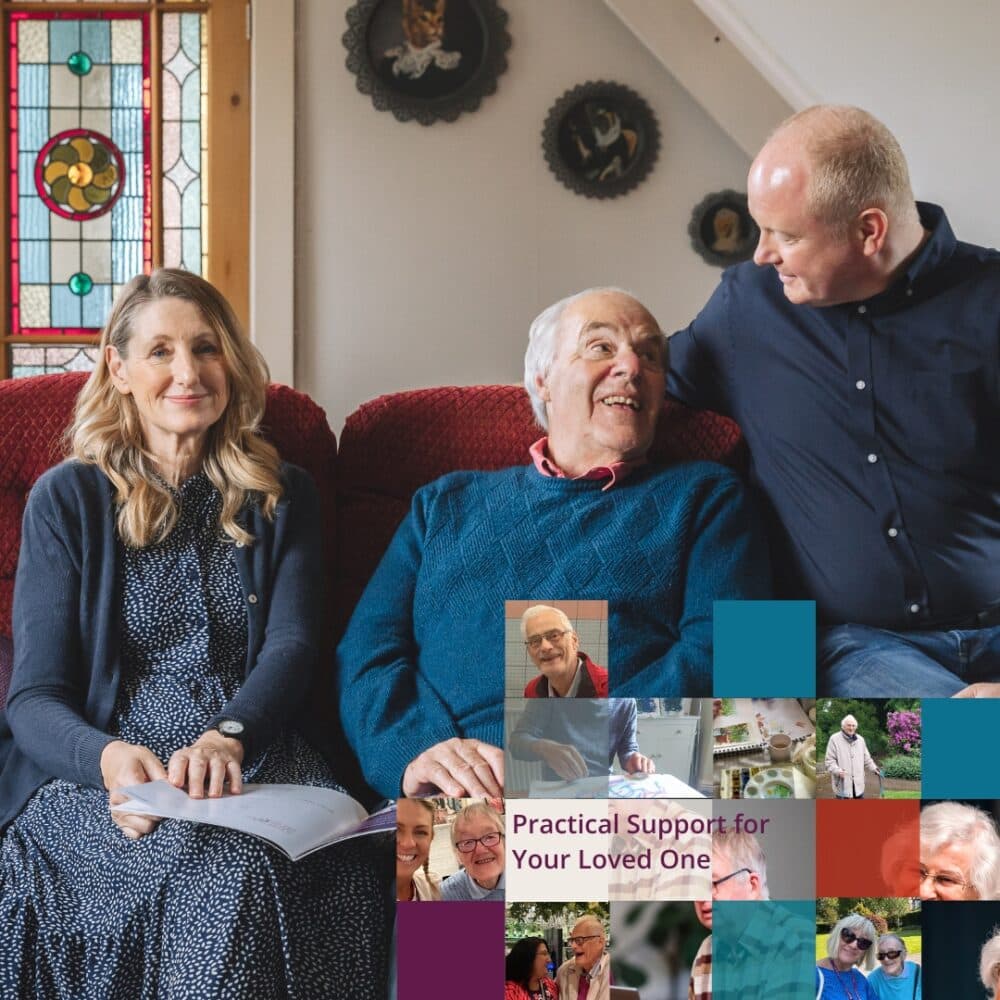 Family happy to discuss care needs at home sat on the sofa with information to share.