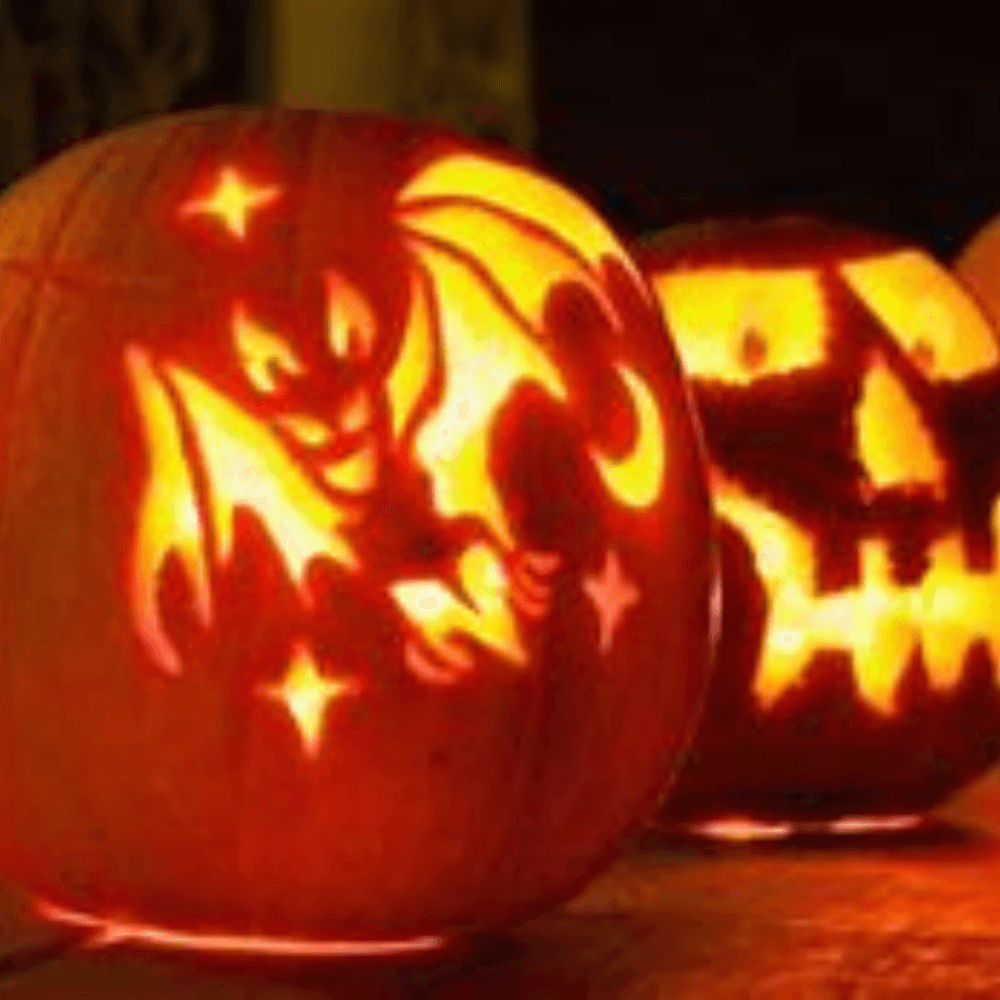 Two glowing jack-o'-lanterns, one carved with a bat and stars, the other with a scary face. - Home Instead