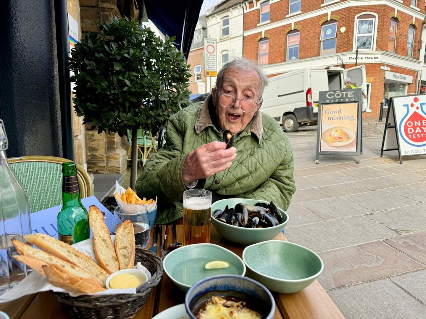 Elderly man enjoying muscles for lunch