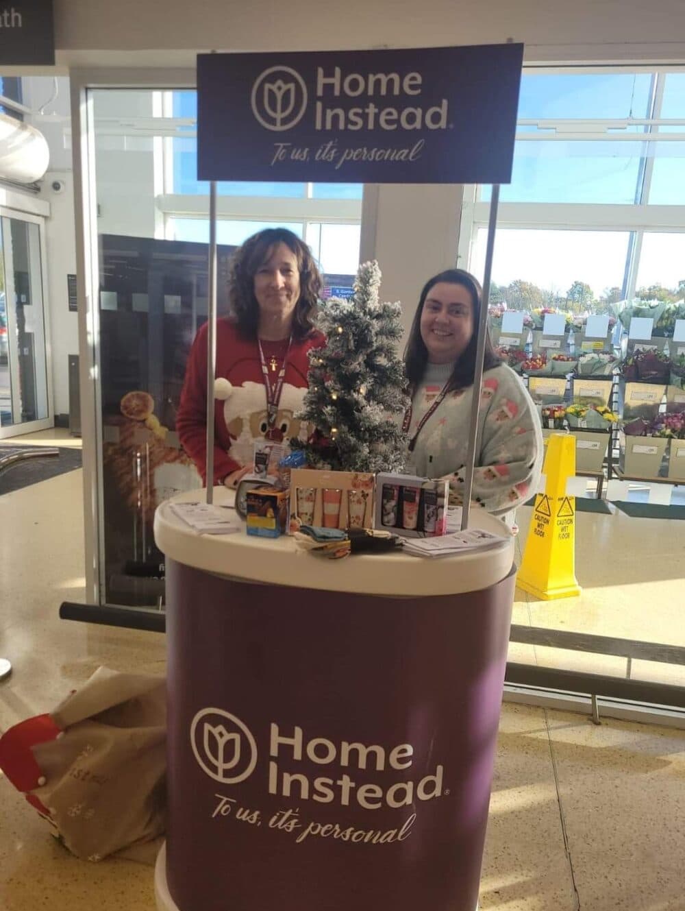 Home instead staff collecting gifts at sainsburys