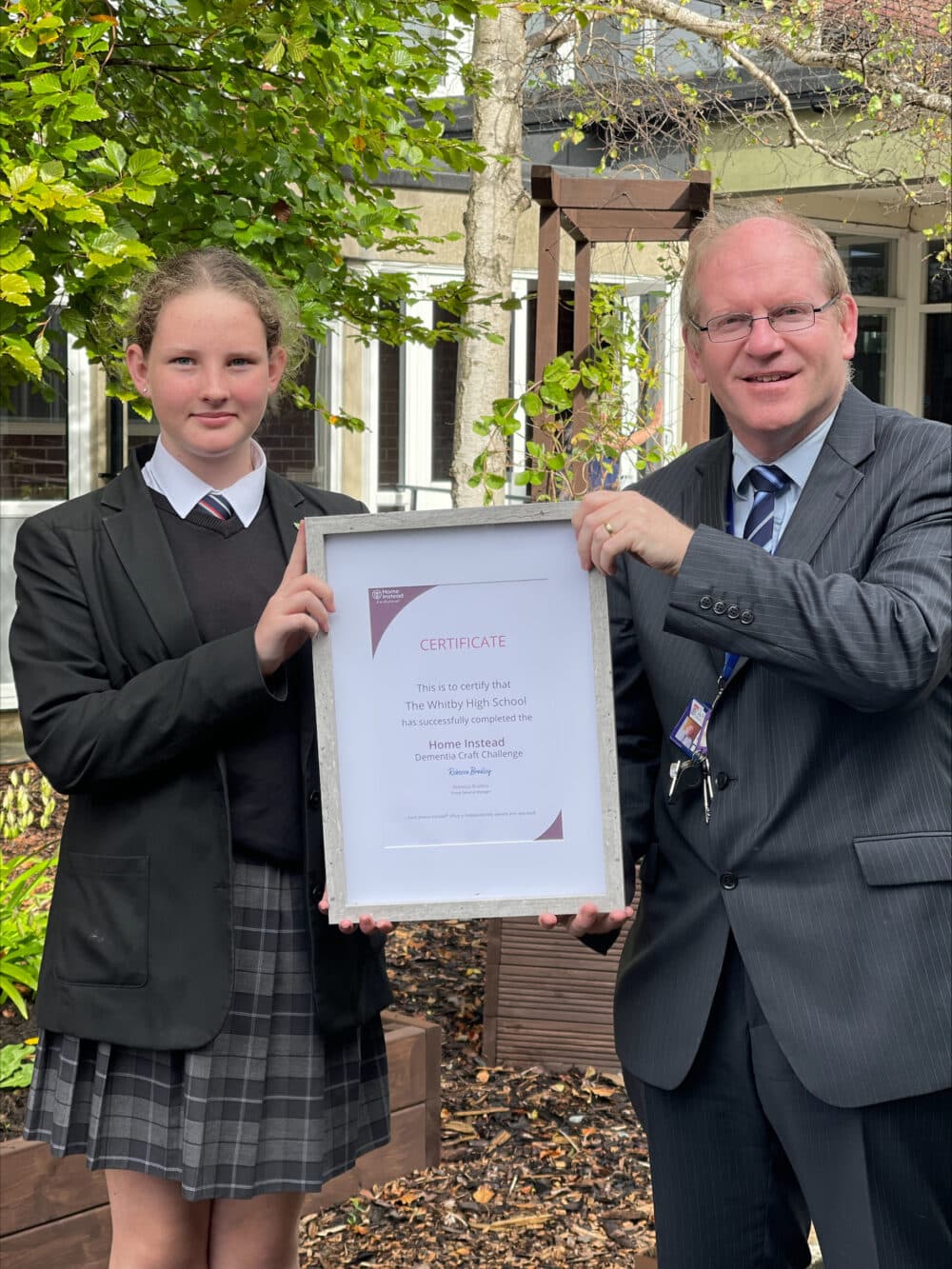 Teacher and student from The Whitby High School with their Home Instead Craft Challenge certificate.