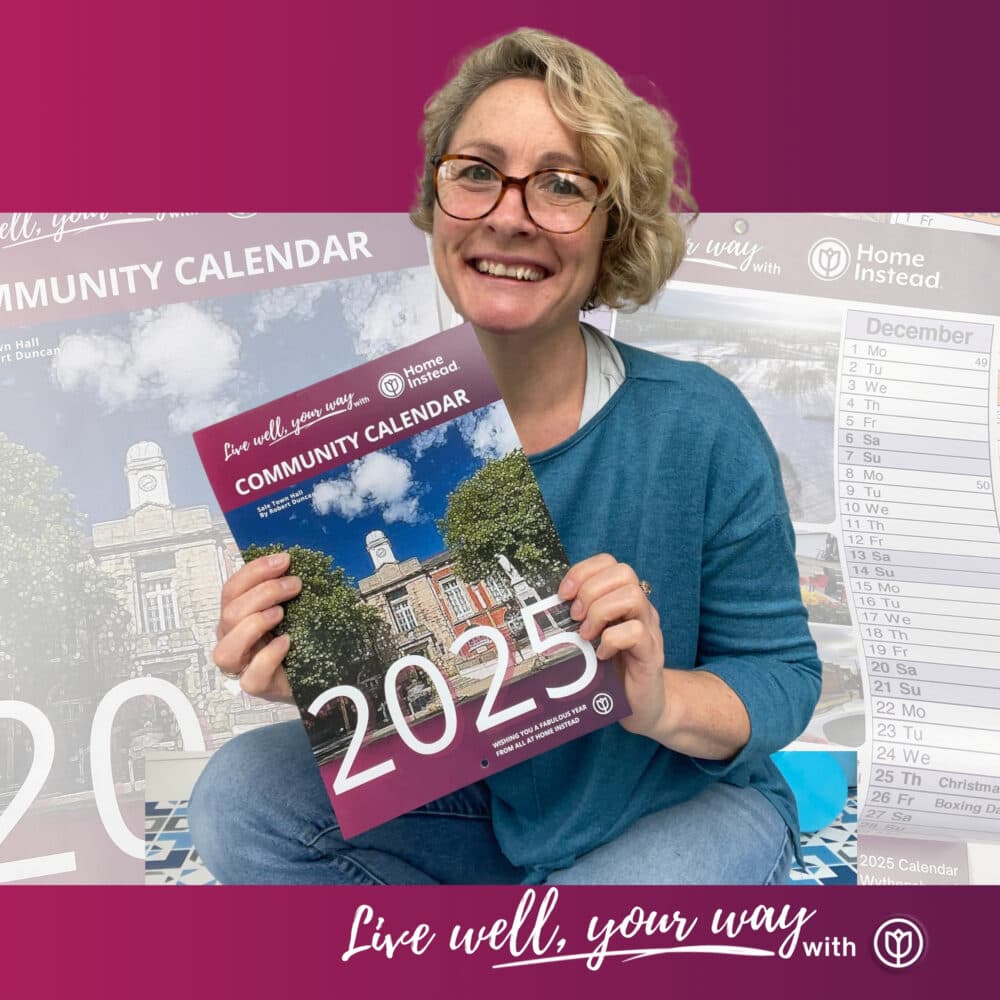 Lucy Gill owner holding the 2025 Community Calendar by Home Instead Altrincham Sale and Wythenshawe