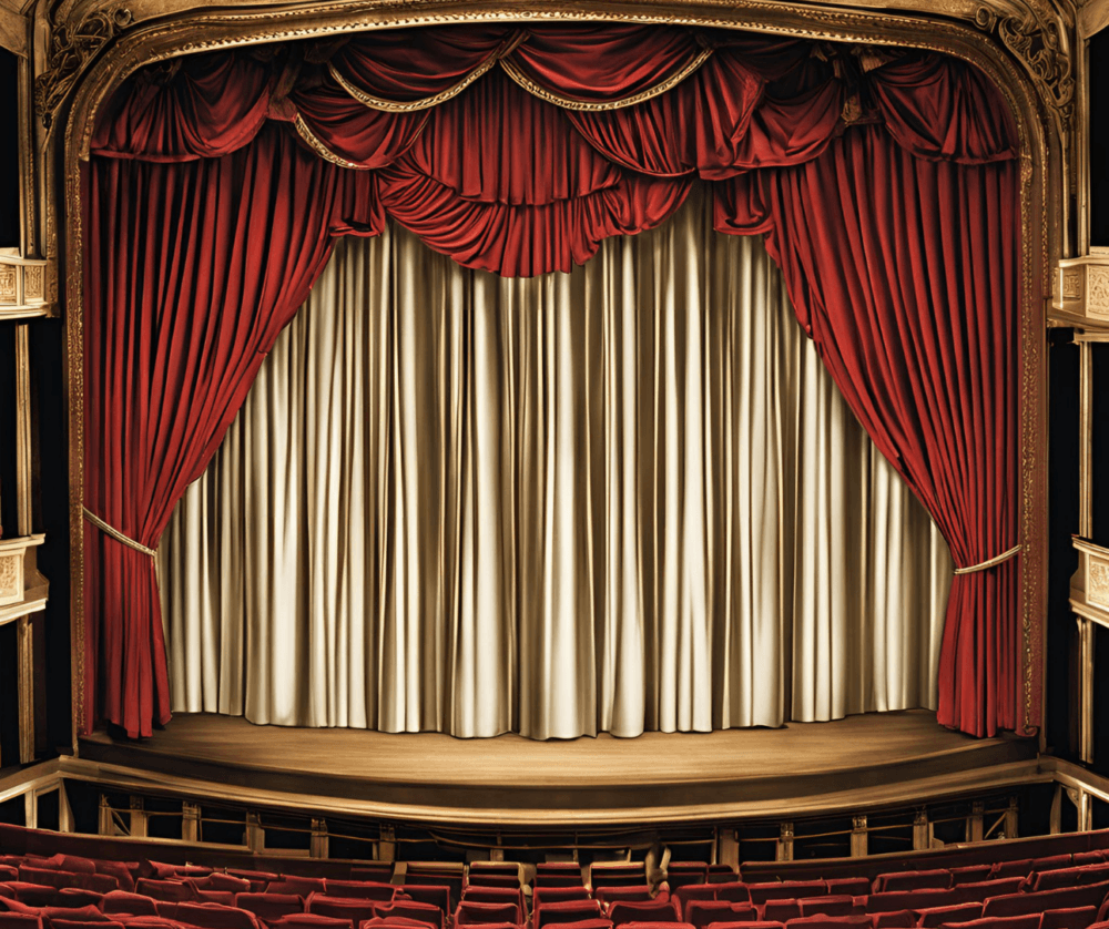 An empty theater stage with red and gold curtains closed, viewed from the audience seats. - Home Instead