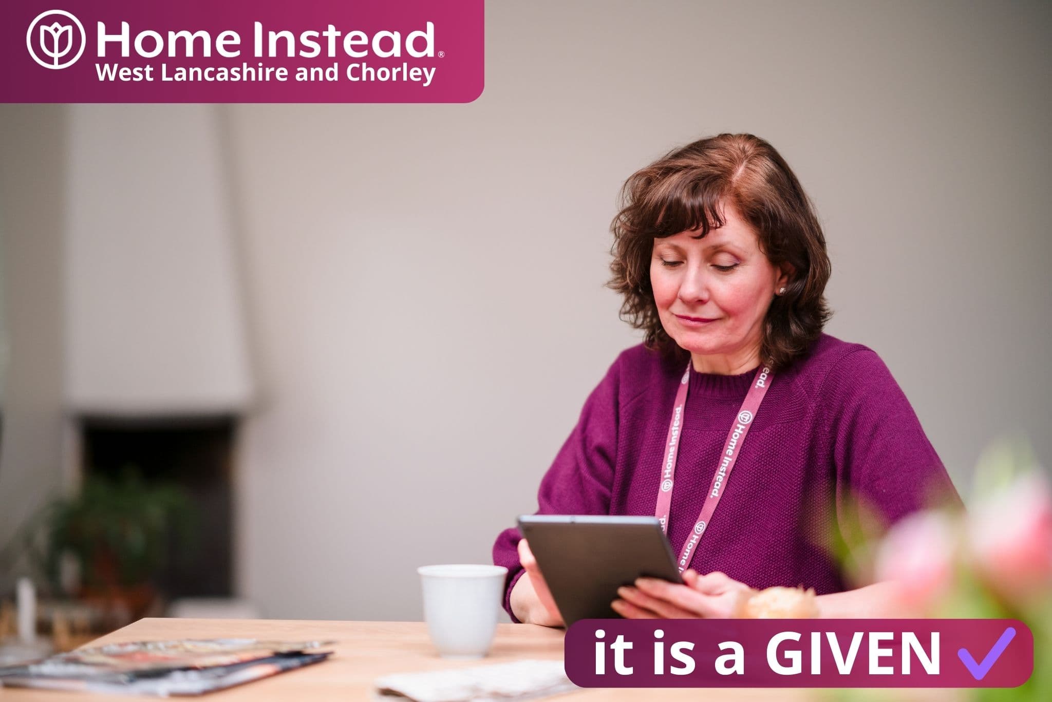 home instead west lancashire and chorley care professional ensuring that the digital, virtual ward is up to date with all monitoring tasks