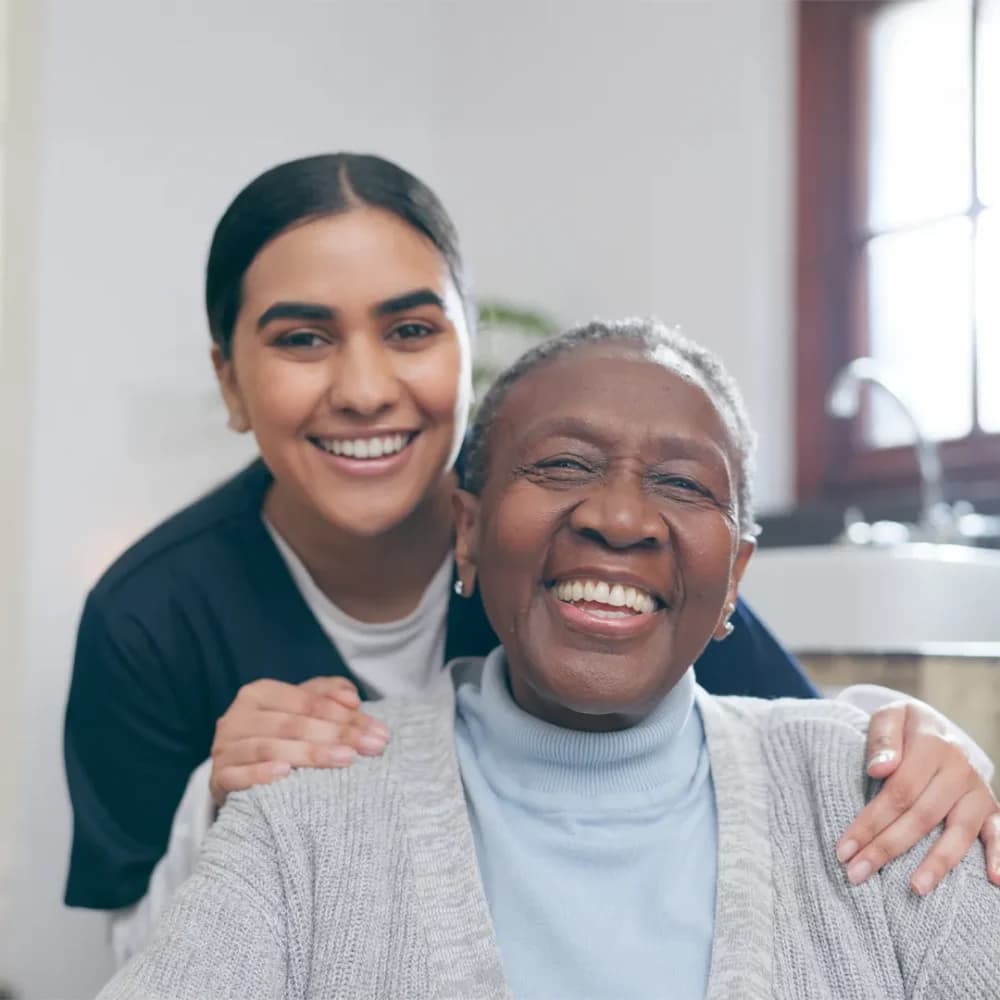 Care Professional laughing and enjoying time with her client
