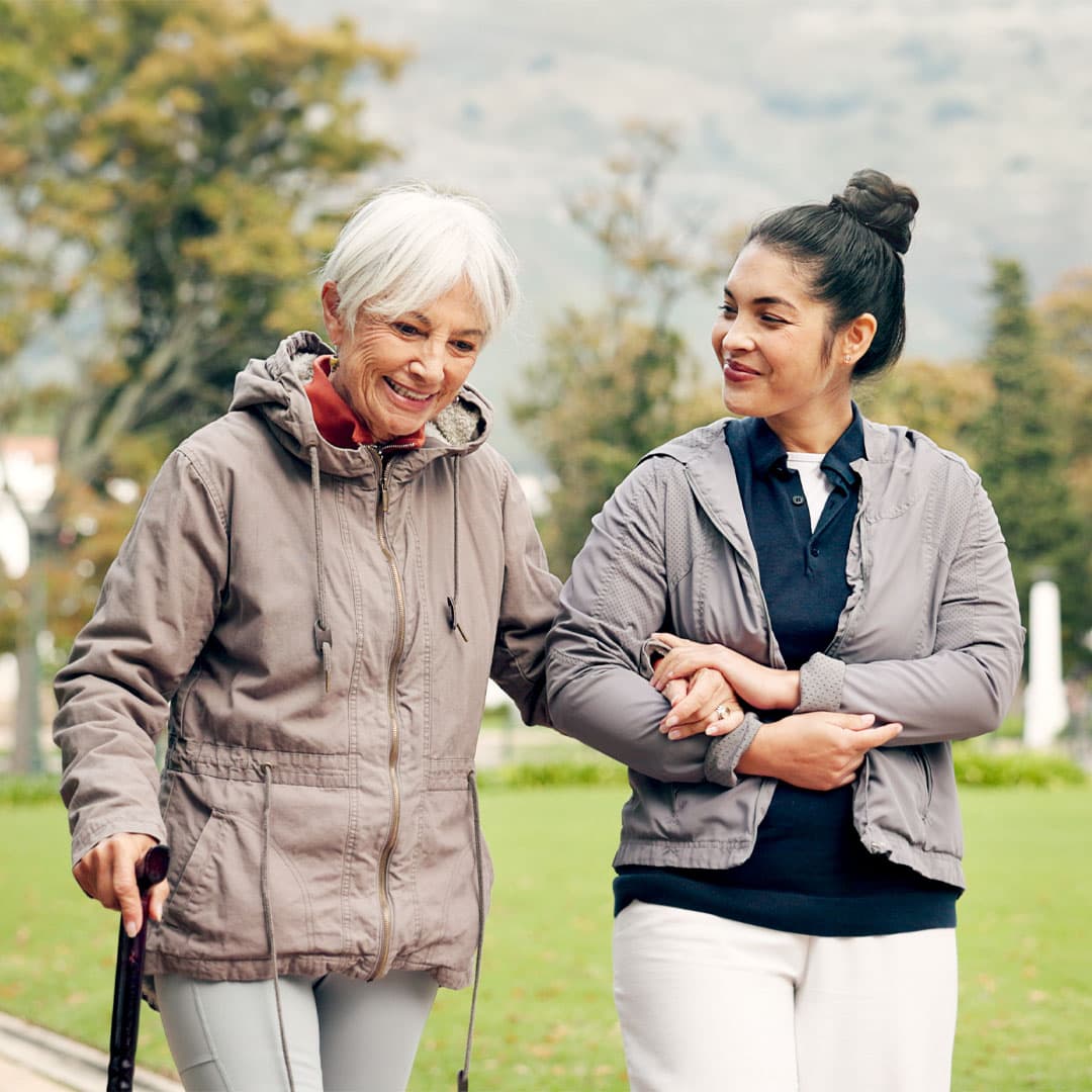 care professional and client walking outdoors