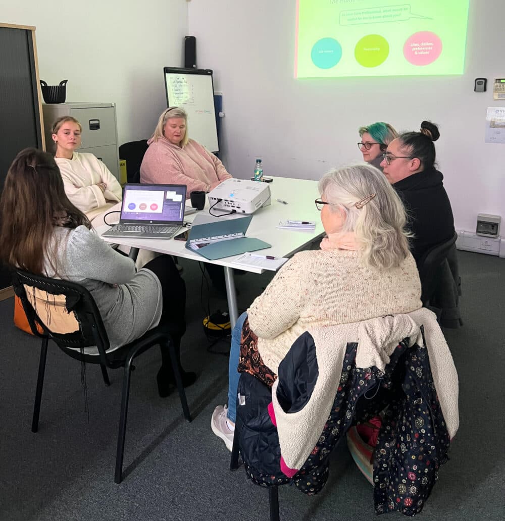 Group of care pros attending dementia training at home Instead Yeovil Sherborne and Bridport