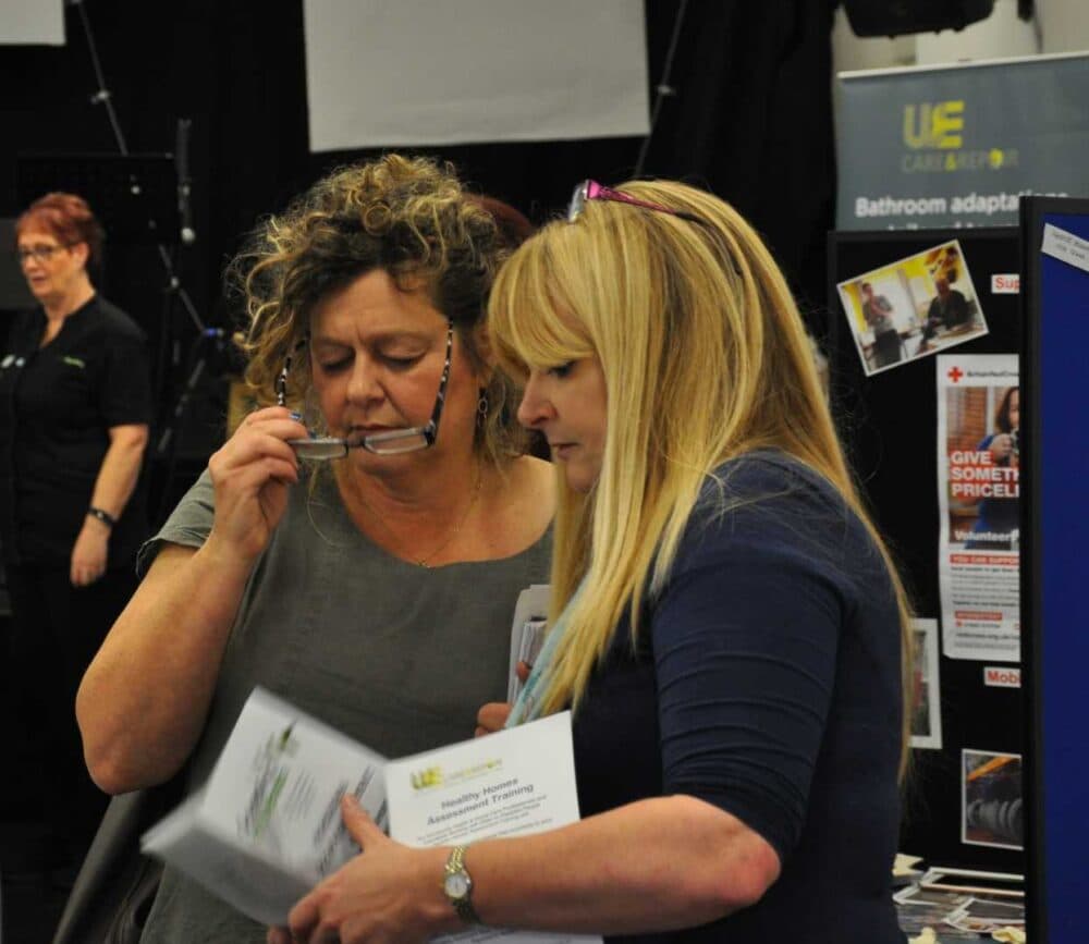 A woman looking at a woman's eye. - Home Instead