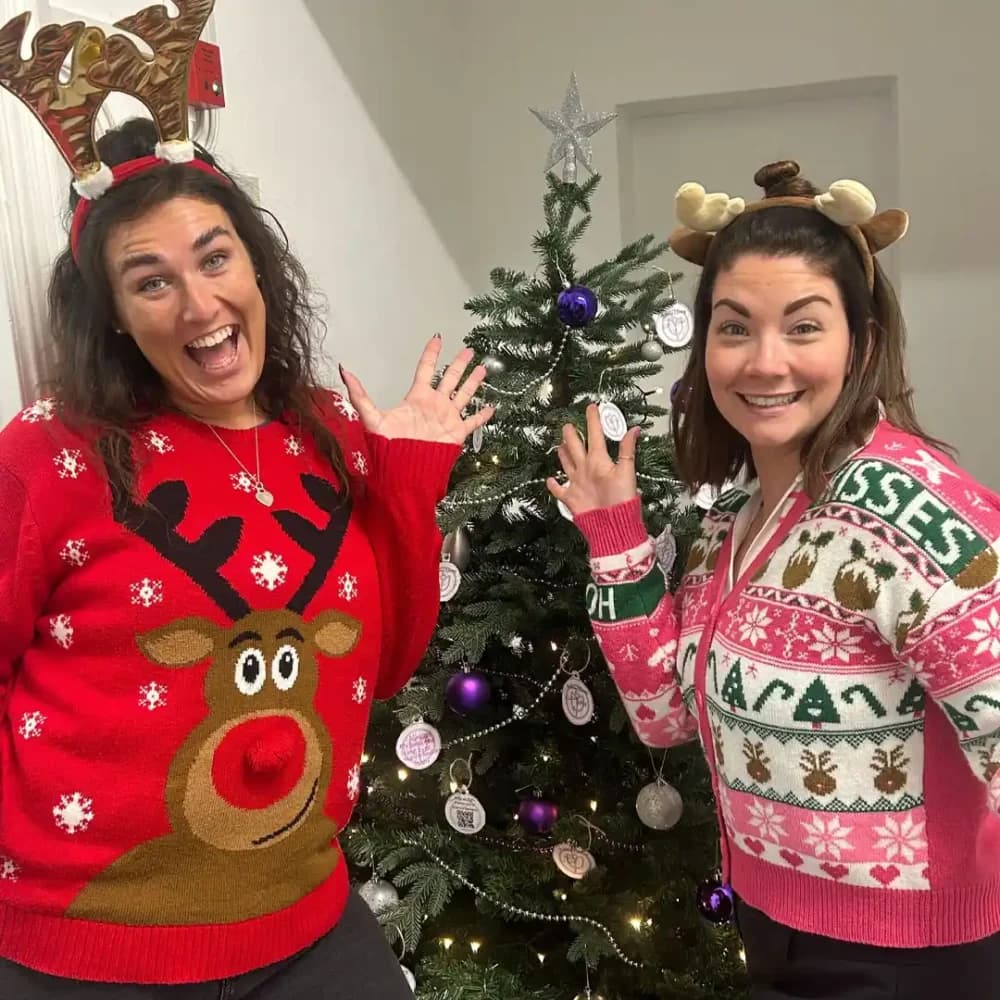 Home Instead Business Development Managers Steph and Lauren in Christmas jumpers