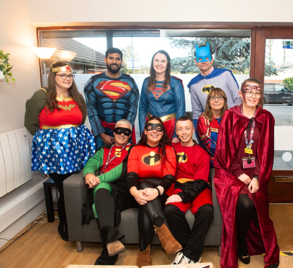 Office team wearing super hero costume