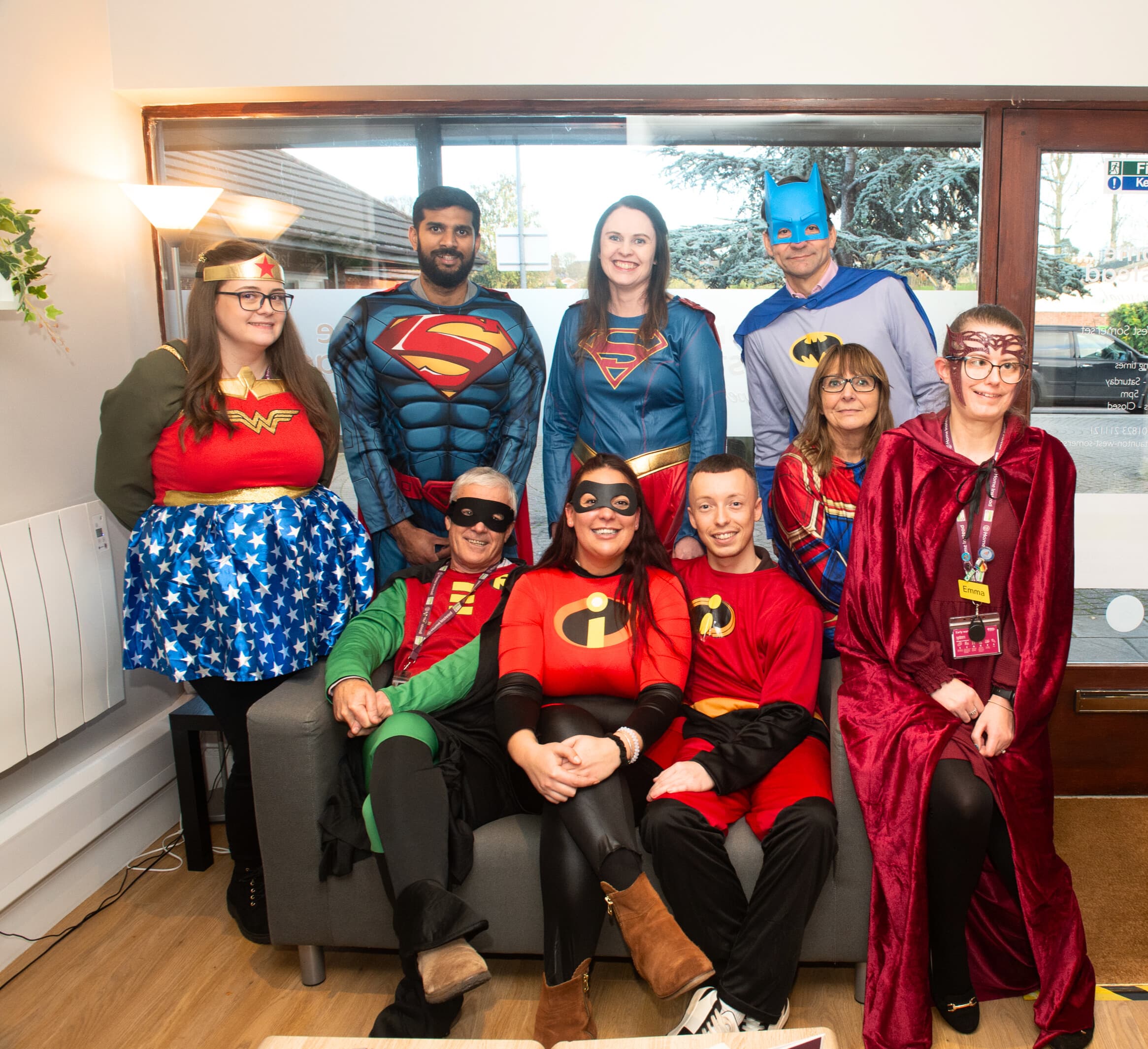 Office team wearing super hero costume