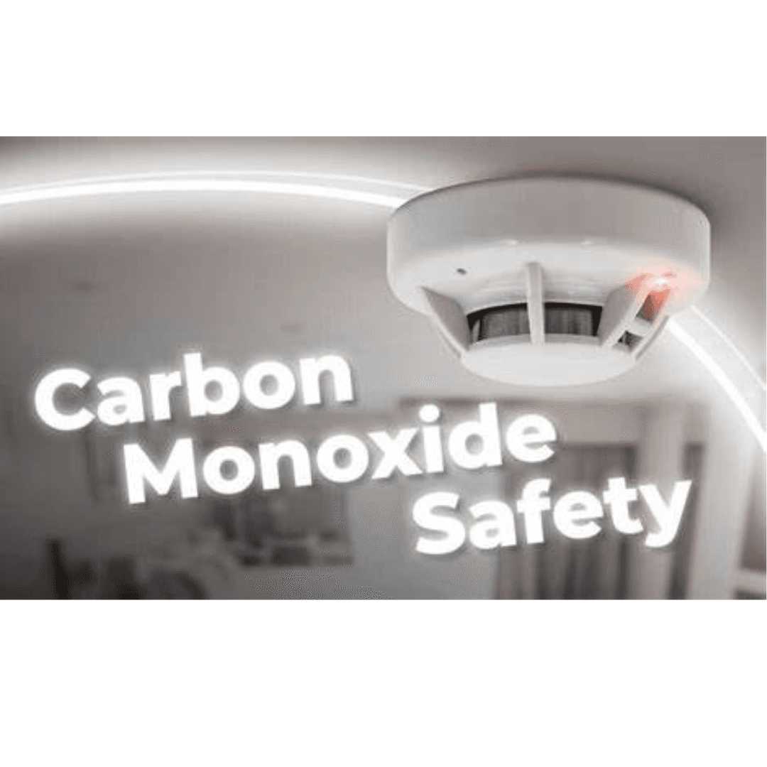 A carbon monoxide detector on a ceiling with the text "Carbon Monoxide Safety" next to it. - Home Instead