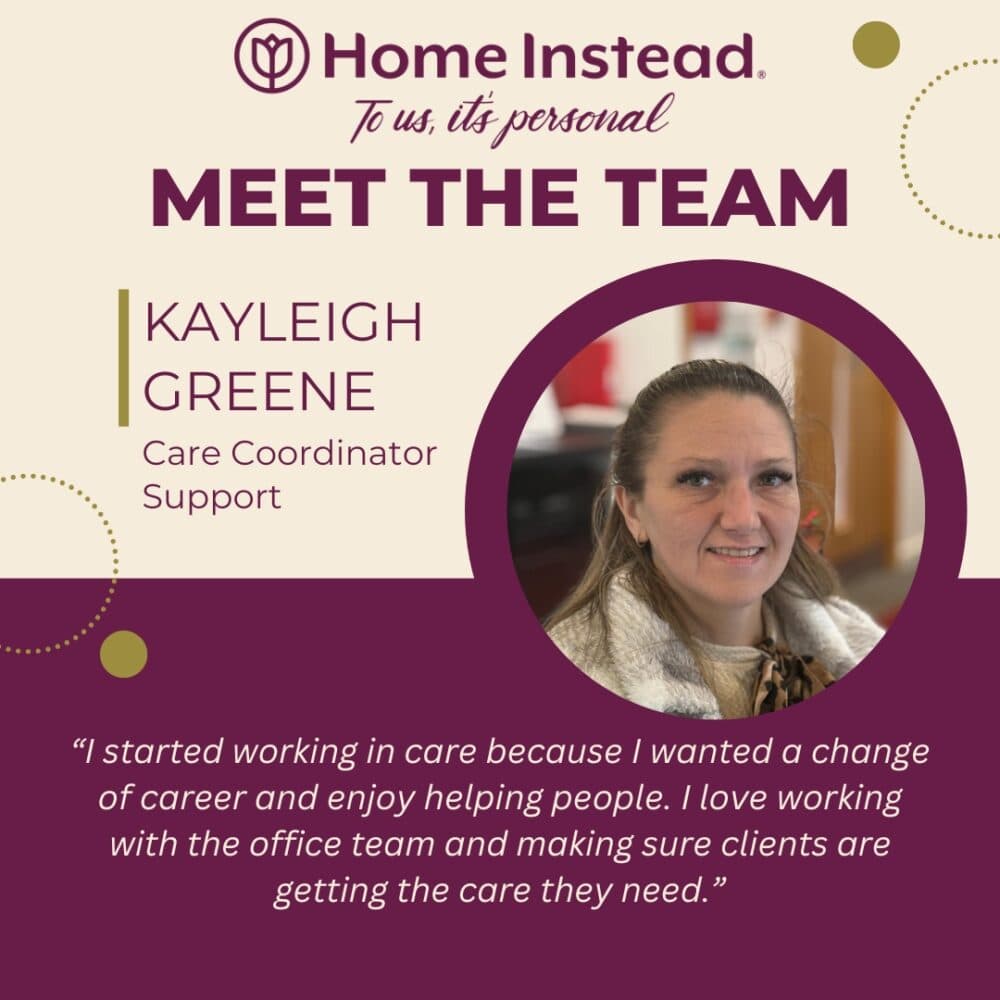 Woman with long hair in a ponytail, wearing a scarf, smiles for a staff introduction at Home Instead. - Home Instead