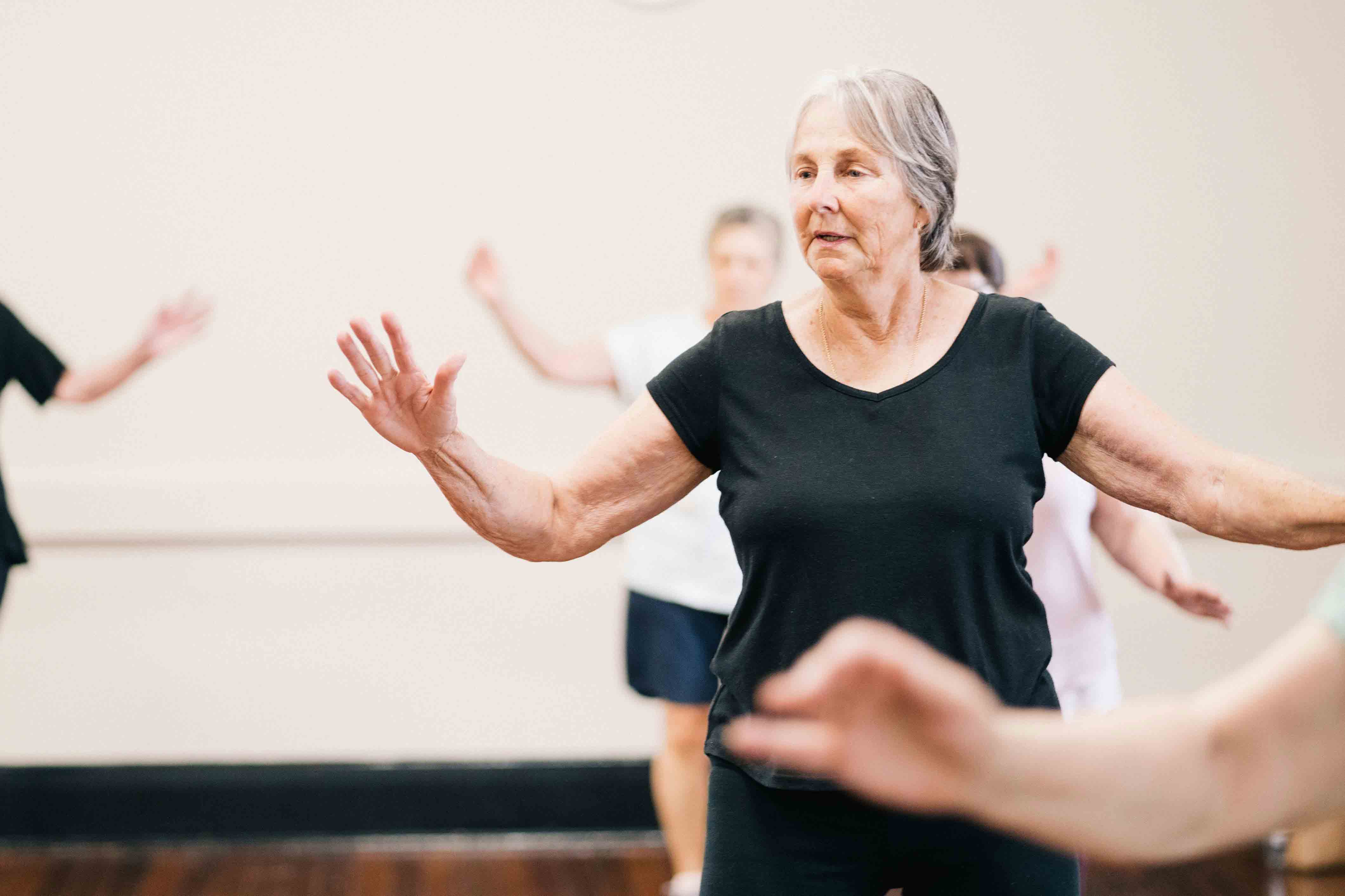 Older adult exercising to stay healthy.