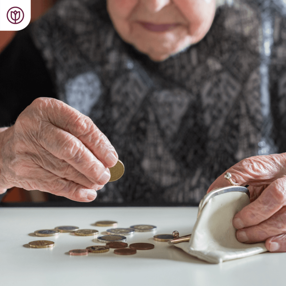 Elderly lady with purse and money coins - home care costs