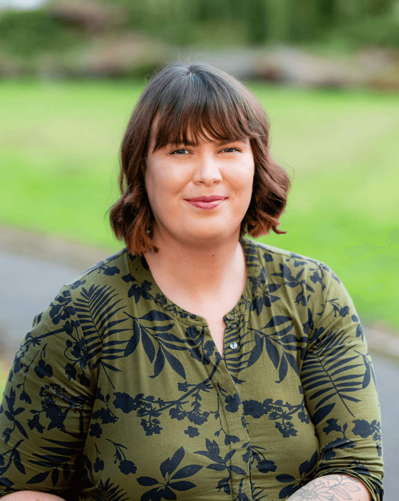 An elderly man smiling while playing chess with his caregiver, receiving one-on-one companionship as part of respite home care.