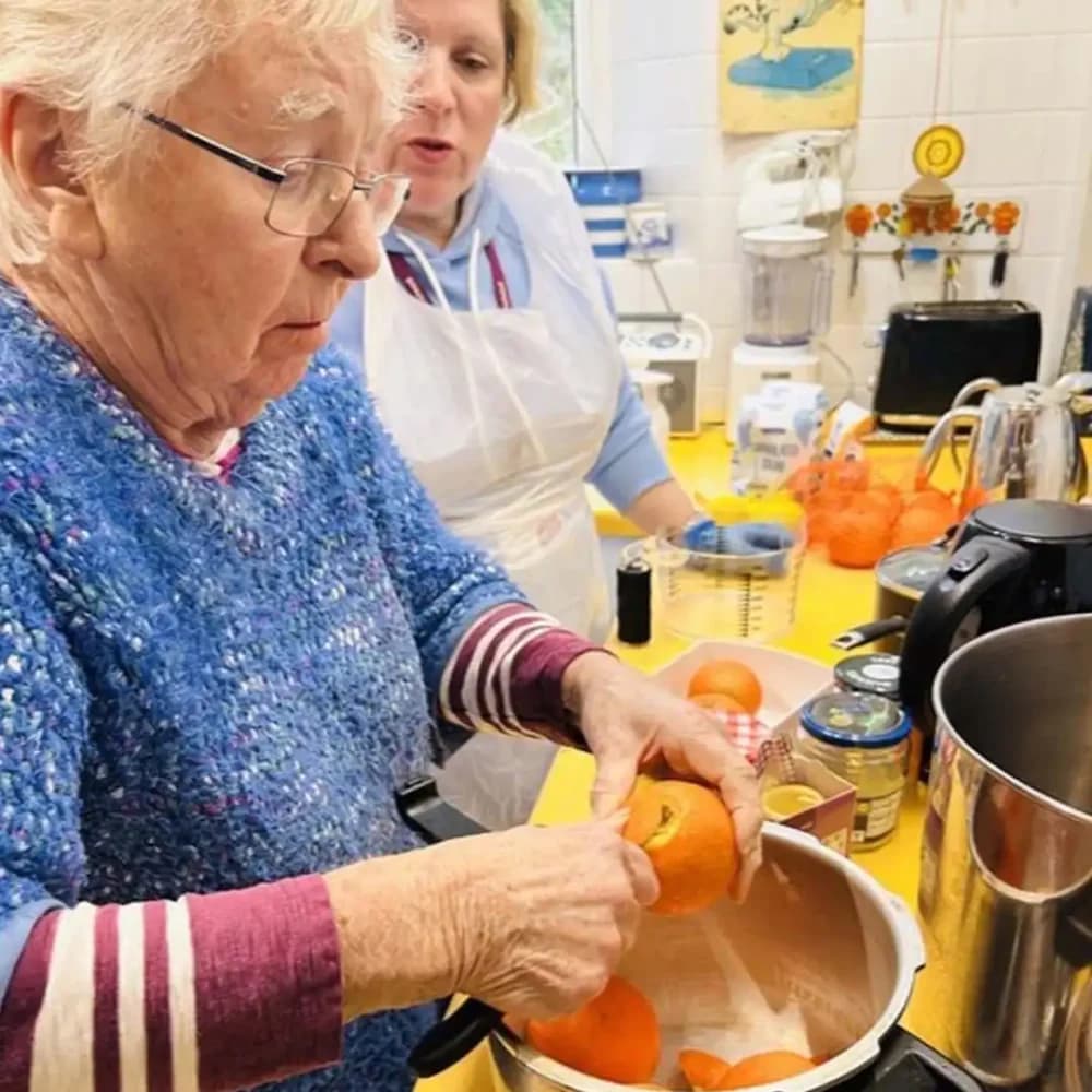 Home Instead Farnborough client Pat preparing marmalade with her care pro Angie