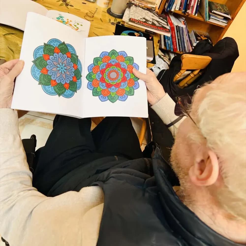 Home Instead Ascot client Roger displaying his Mandala artwork