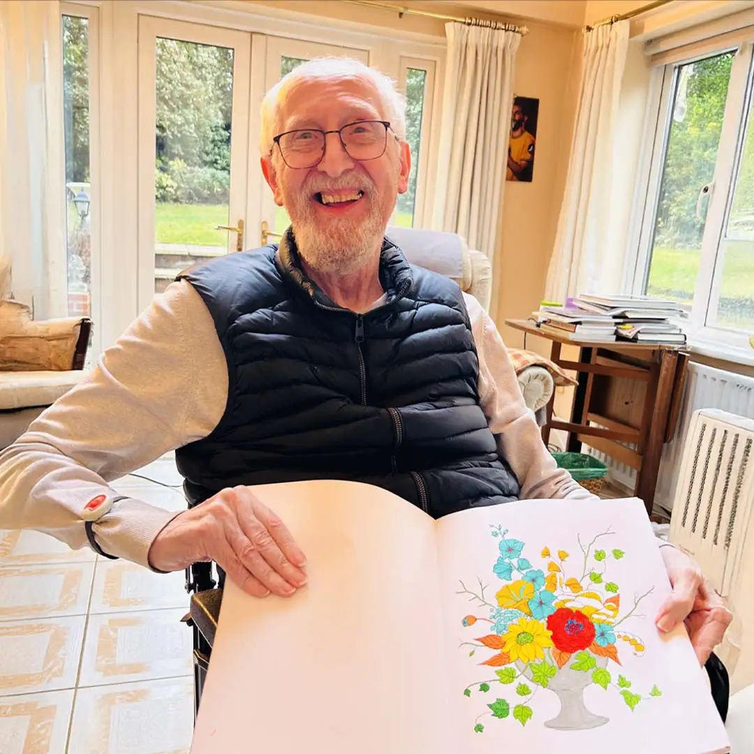 Home Instead Ascot client Roger showcasing his artwork