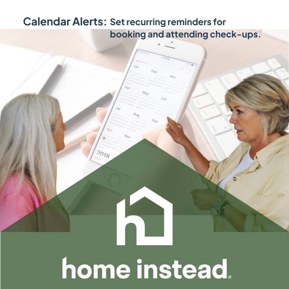Two women discuss a calendar on a smartphone, with "home instead" logo and reminder text above. - Home Instead