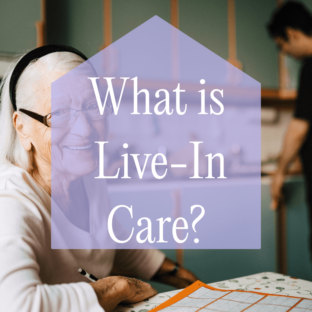 Smiling elderly woman at a table with "What is Live-In Care?" text overlayed. - Home Instead